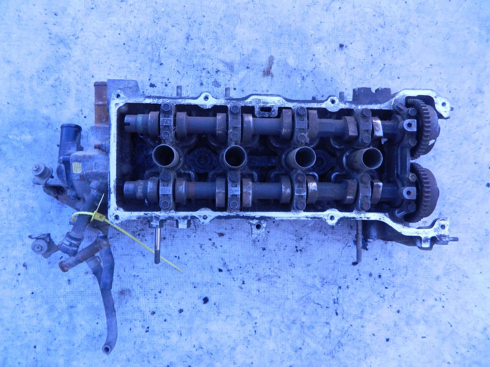 Головка блока цилиндров NISSAN QG15DE (Б/У) 79768978