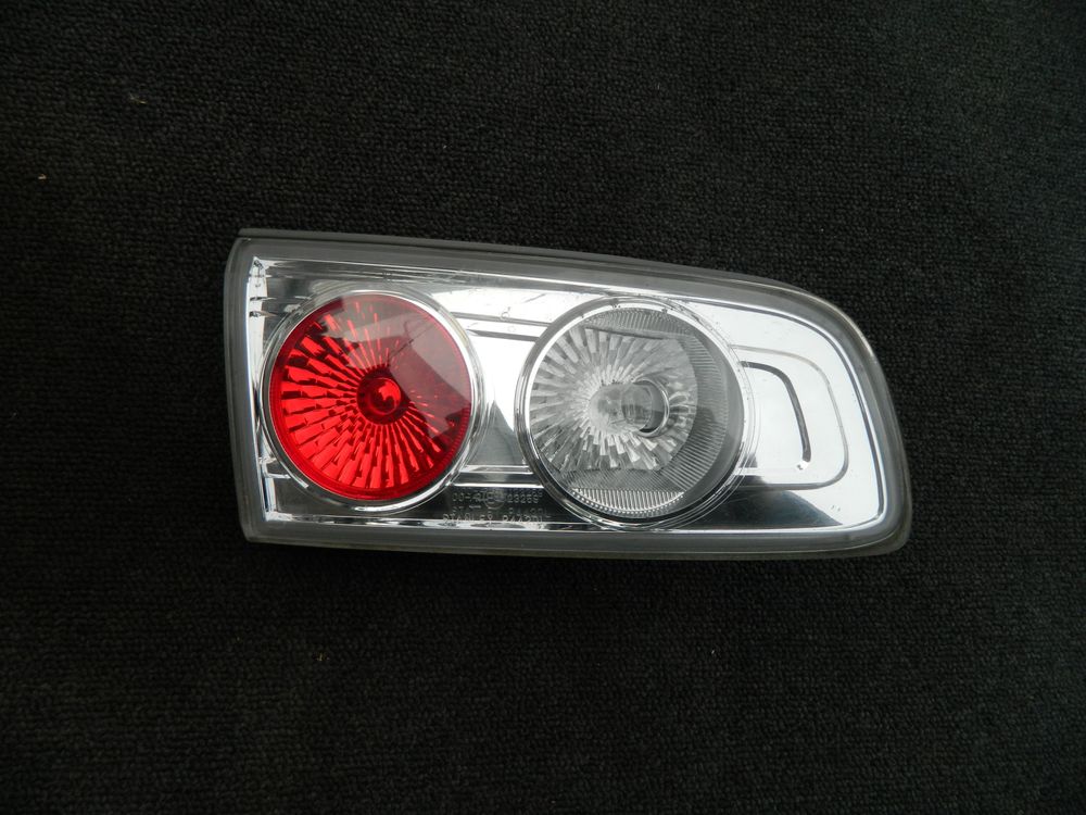 Фонарь в крышку багажника MAZDA DEMIO DY3W Зад Лев (Контрактный) 10015723