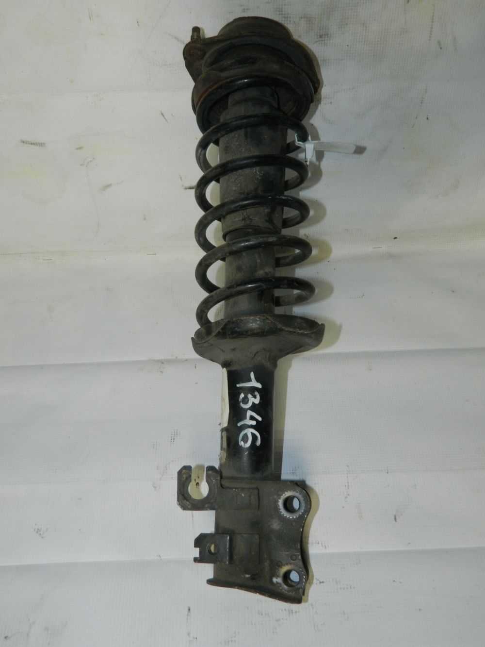 Стойка подвески MAZDA DEMIO DW3W B3 Перед Лев (Контрактный) 35021049