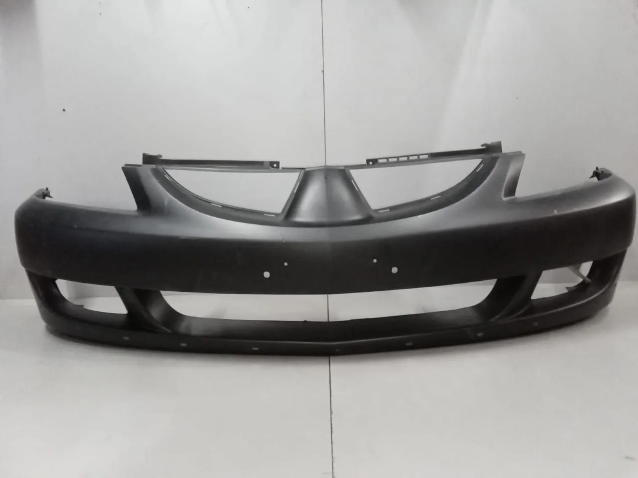 Бампер передний API MB24400001000 MITSUBISHI LANCER 2004-2006