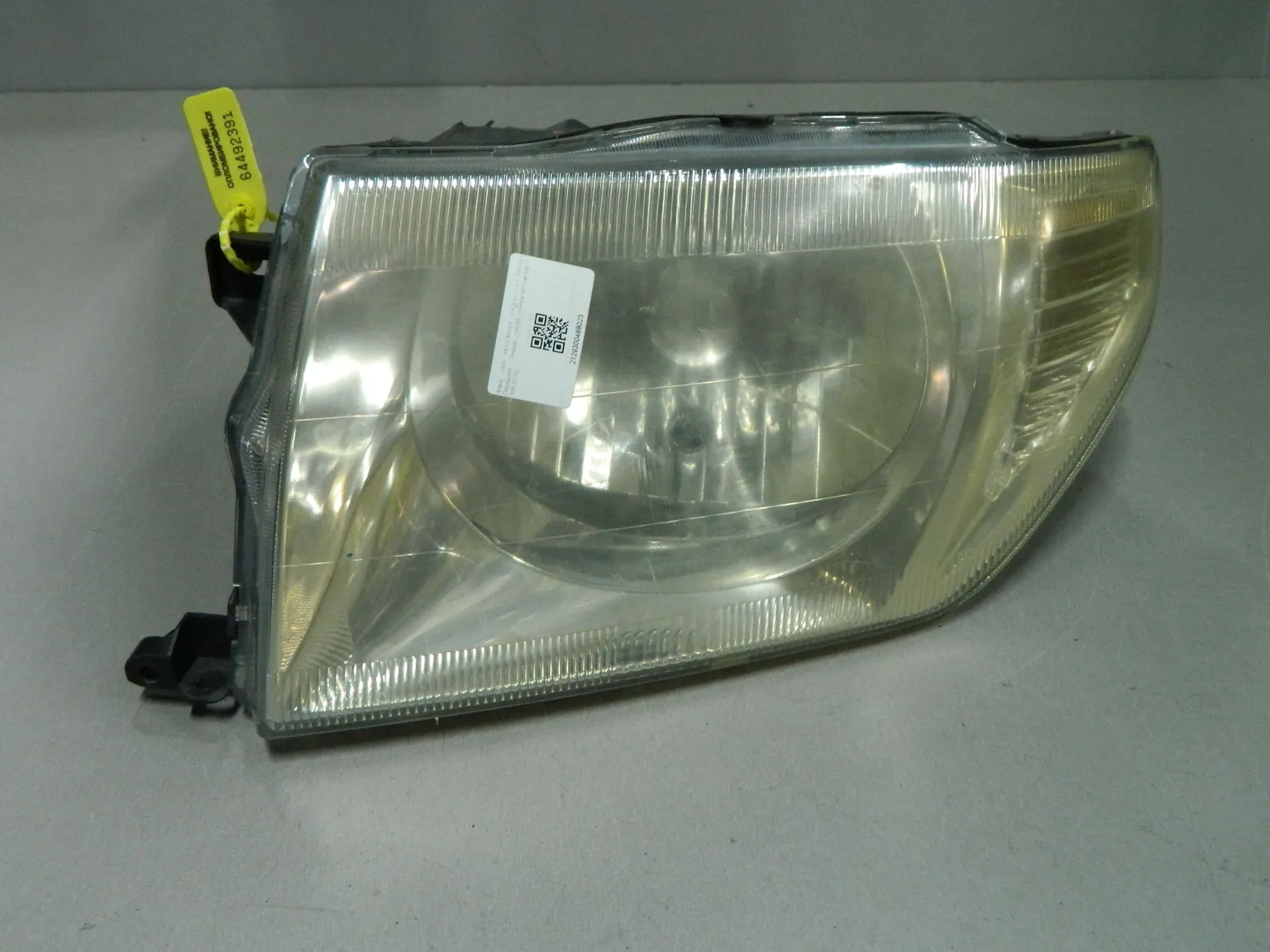 Фара MITSUBISHI PAJERO IO H76W Перед Лев (Контрактный) 64492391