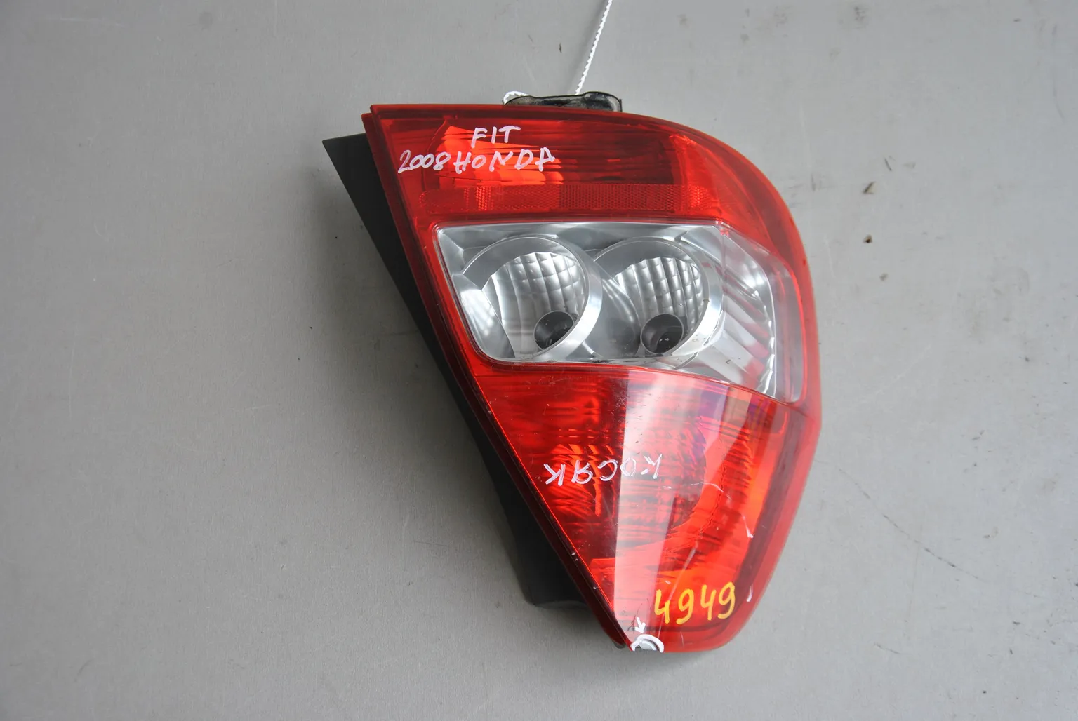 Фонарь HONDA FIT Зад Лев (Контрактный) 45990672