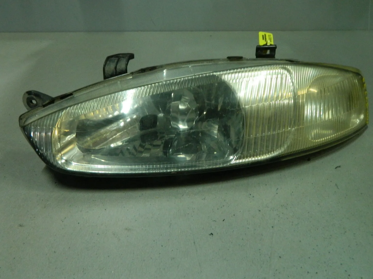 Фара MITSUBISHI MIRAGE CJ2A Перед Лев (Контрактный) 64492378