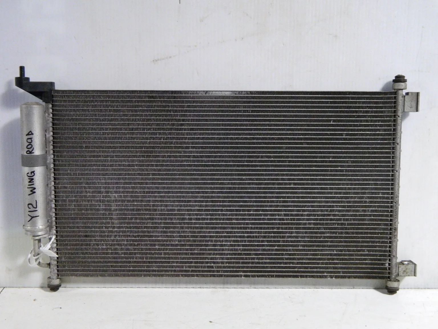 Радиатор кондиционера NISSAN WINGROAD Y12 (Контрактный) 69586592