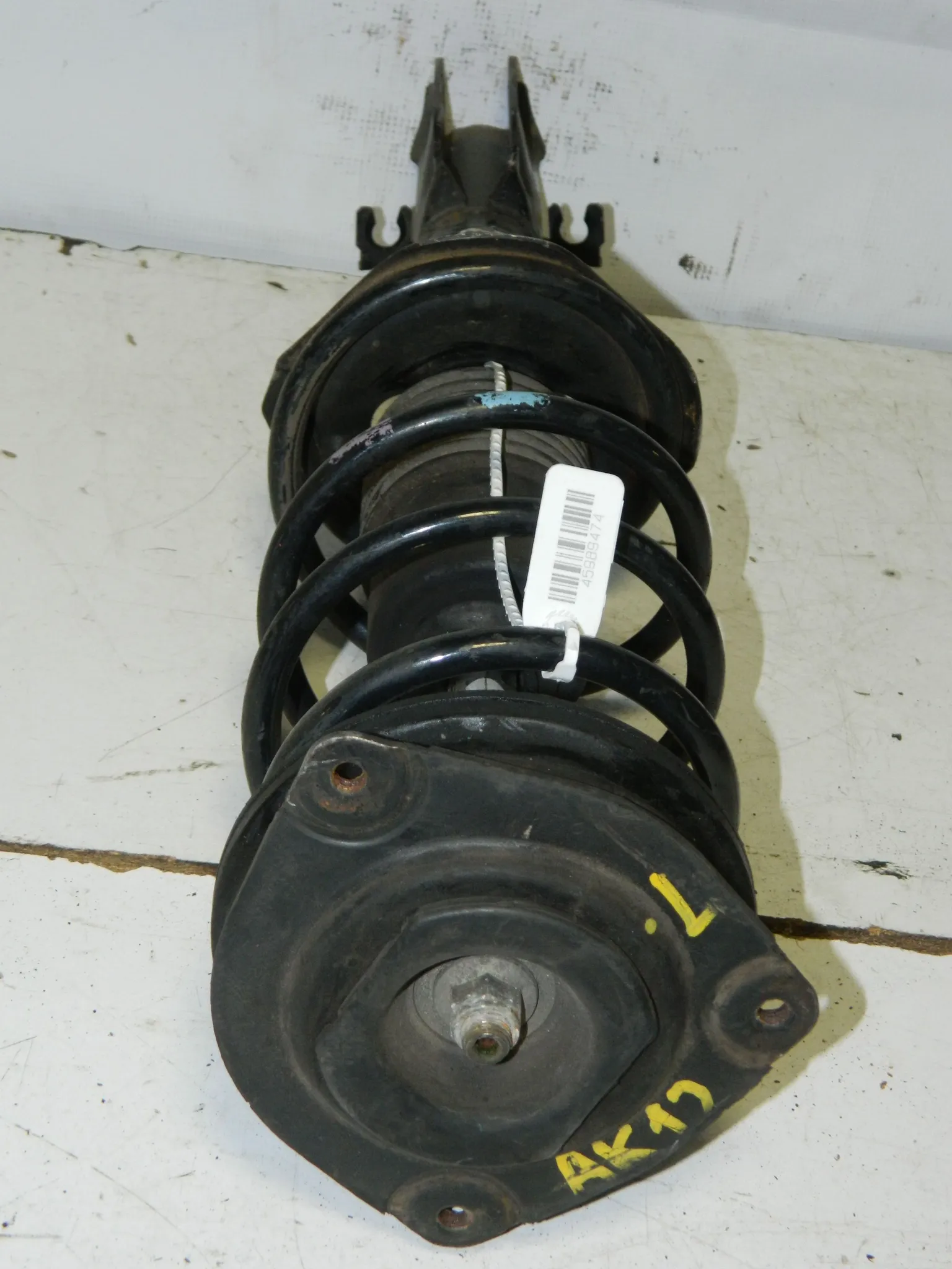 Стойка подвески NISSAN MARCH AK12 Перед Лев (Контрактный) 45989474