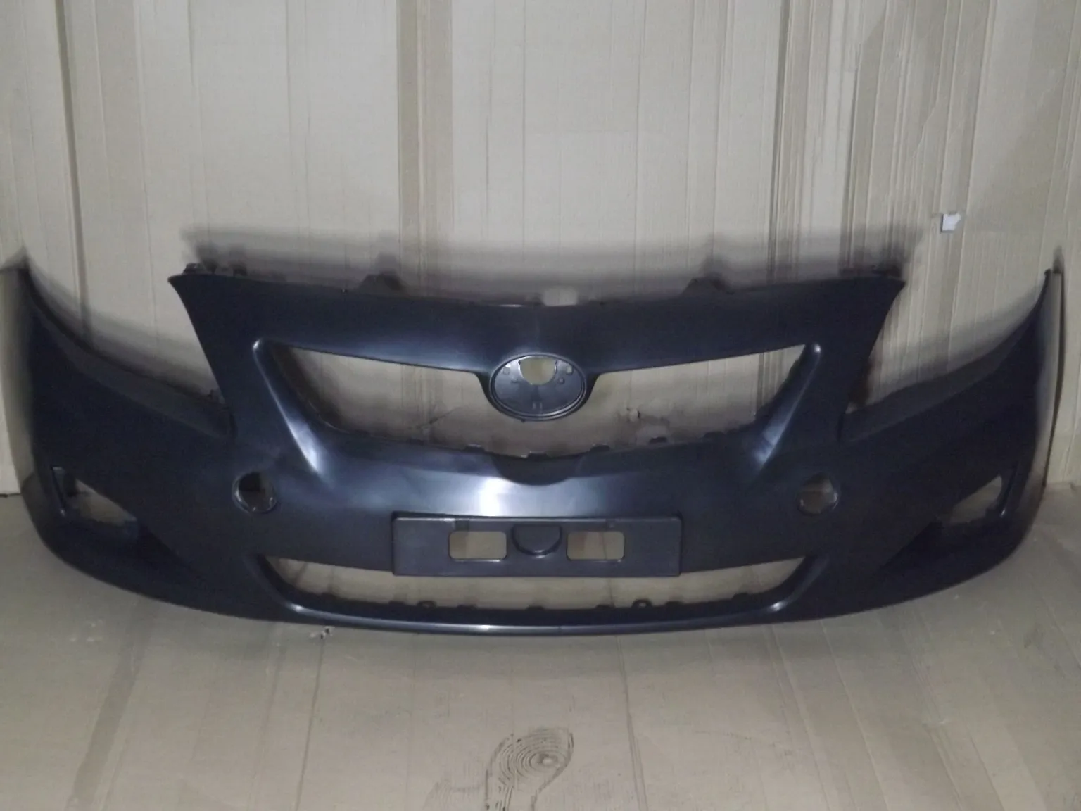 Бампер передний ATB 1ATC0011F TOYOTA COROLLA X 2006 - 2010 под ПТФ E140 / 150