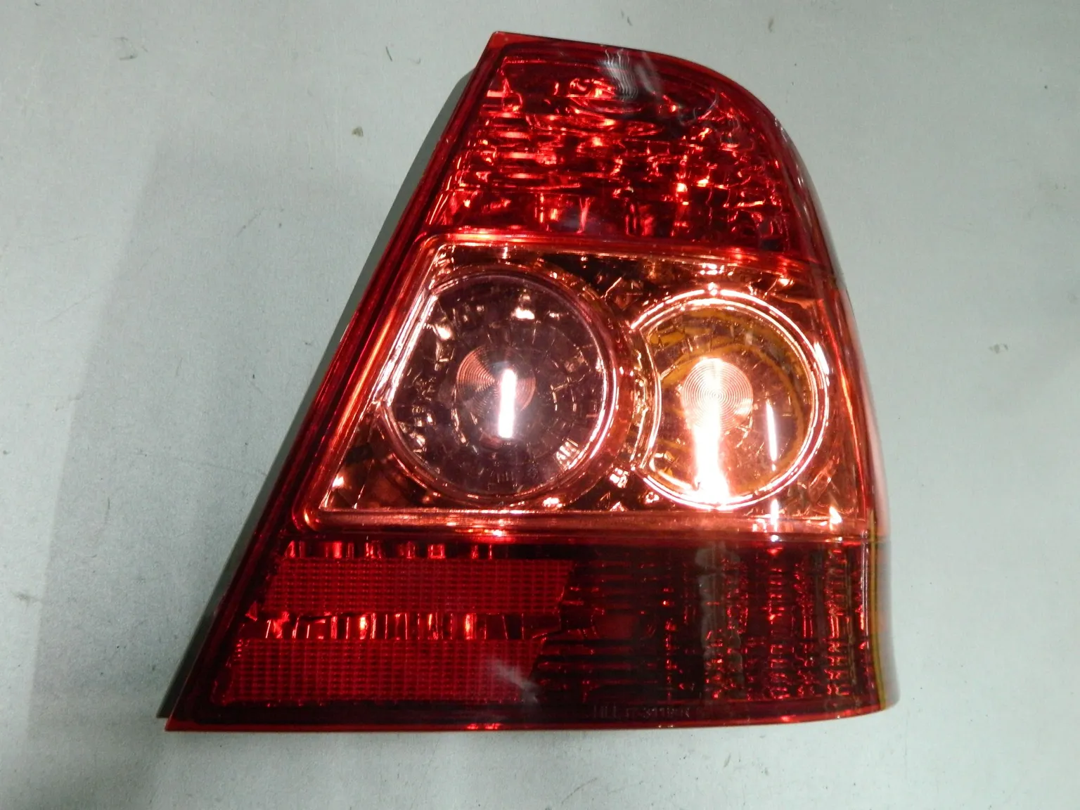 Фонарь TOYOTA COROLLA NZE121 Зад Прав (Новый) 64492494