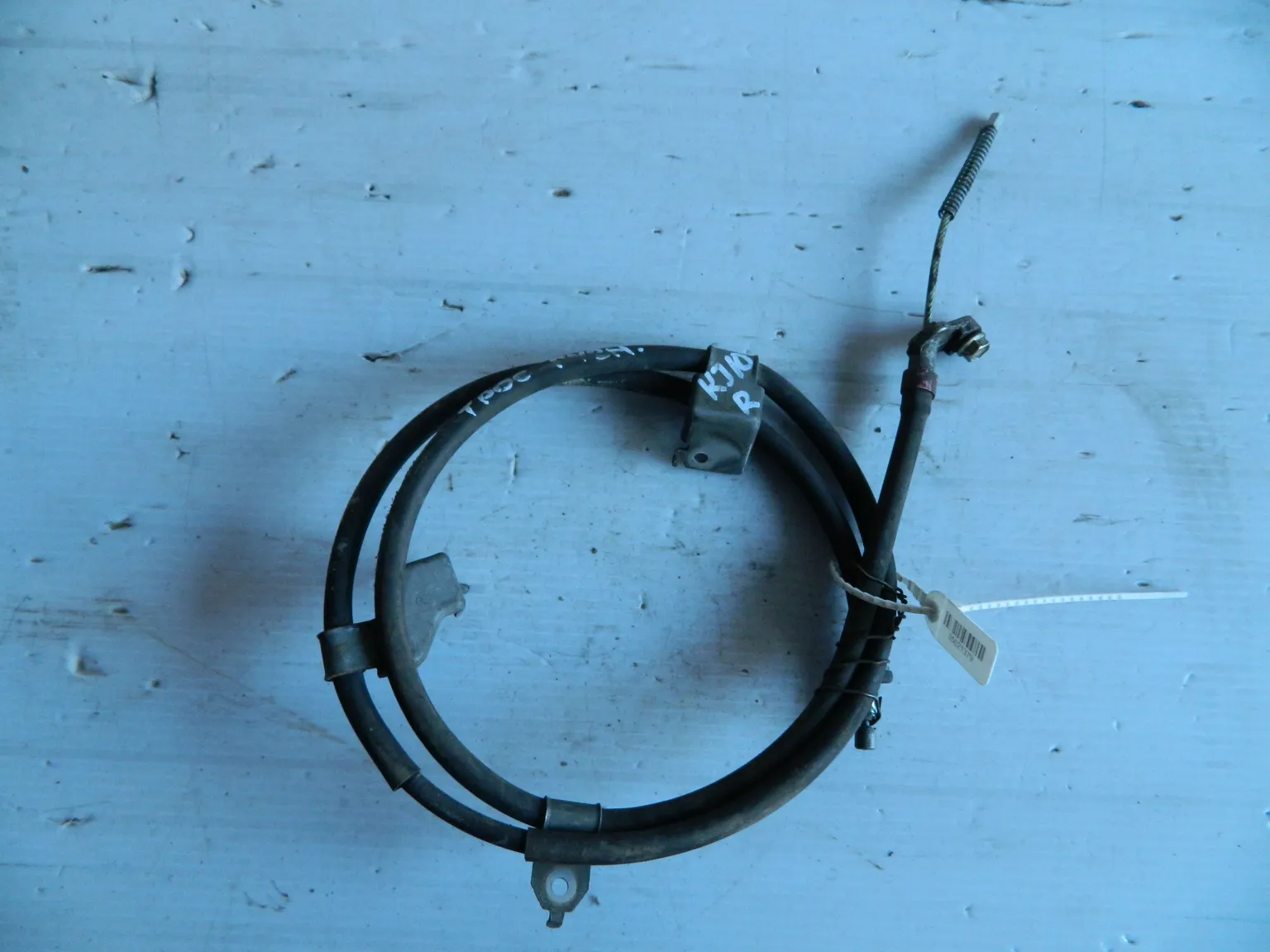 Трос ручника NISSAN QASHQAI KJ10 Прав (Контрактный) 35021379