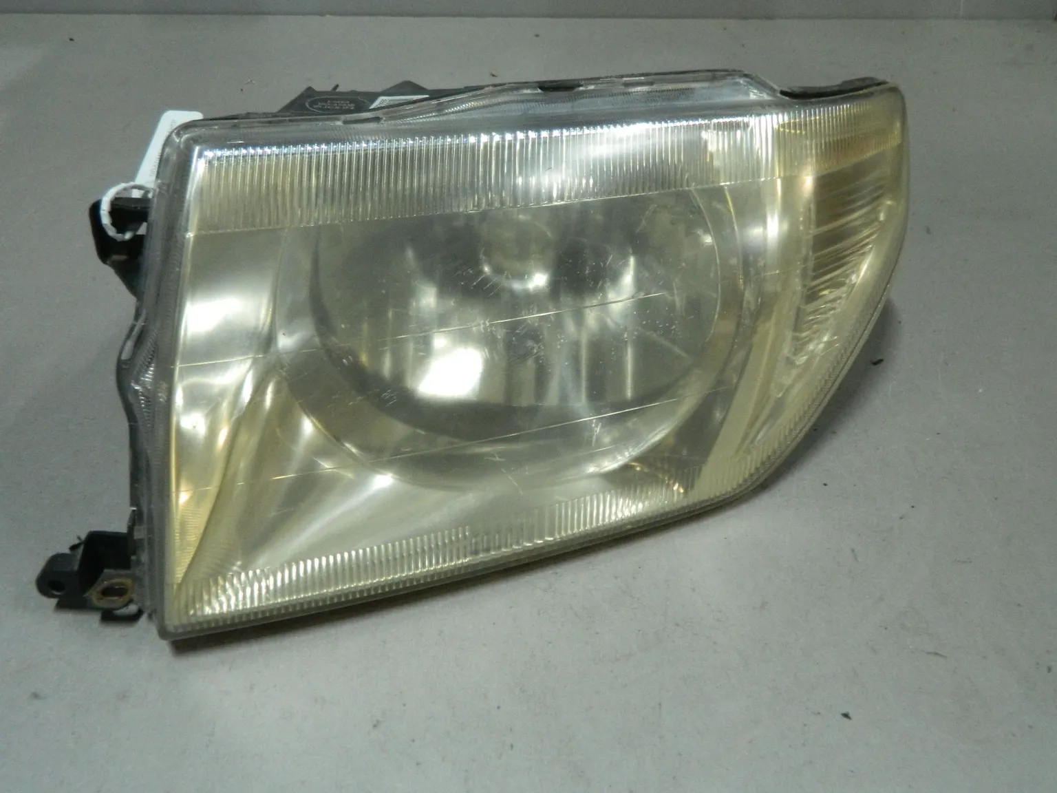 Фара MITSUBISHI PAJERO IO H76W Перед Лев (Контрактный) 68000684