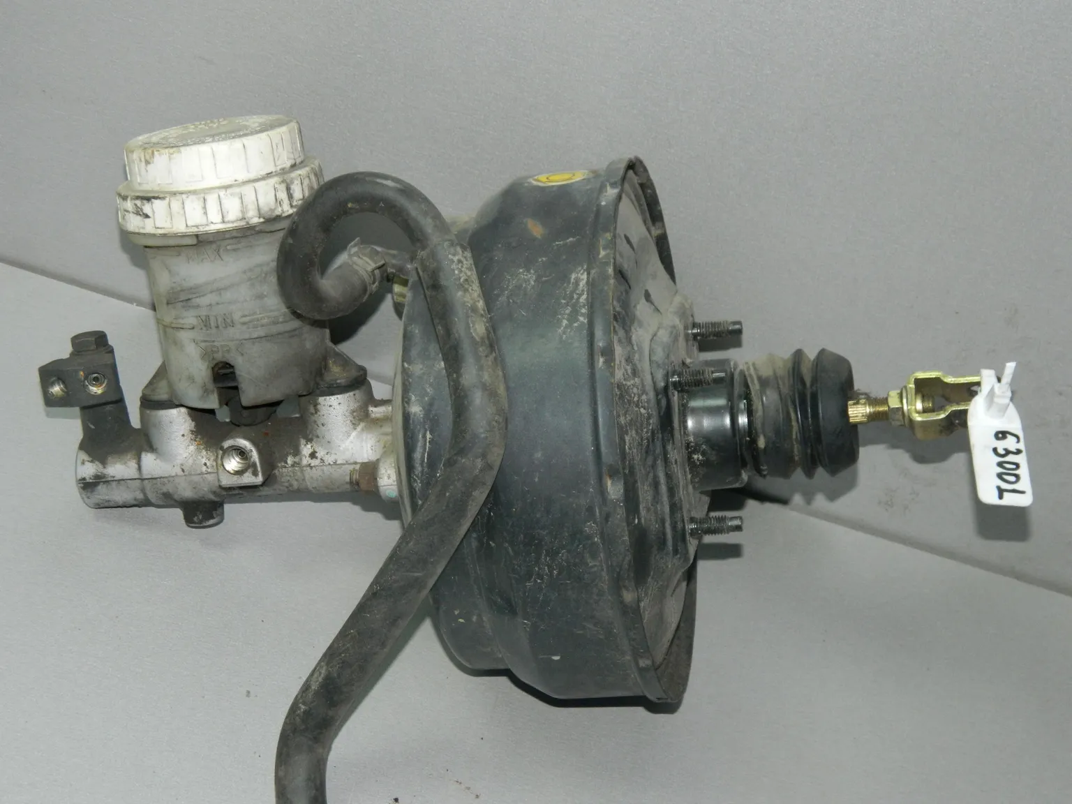 Главный тормозной цилиндр с вакуумником MITSUBISHI L200 4D56 (Б/У) 63001