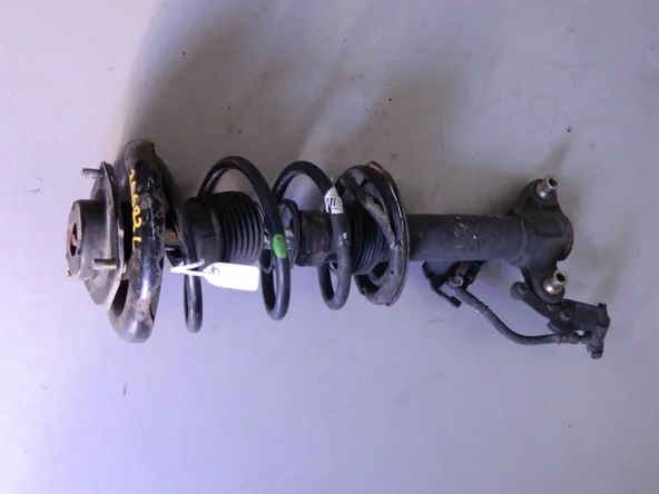 Стойка подвески NISSAN PRIMERA P12 Перед Лев (Контрактный) 68000056