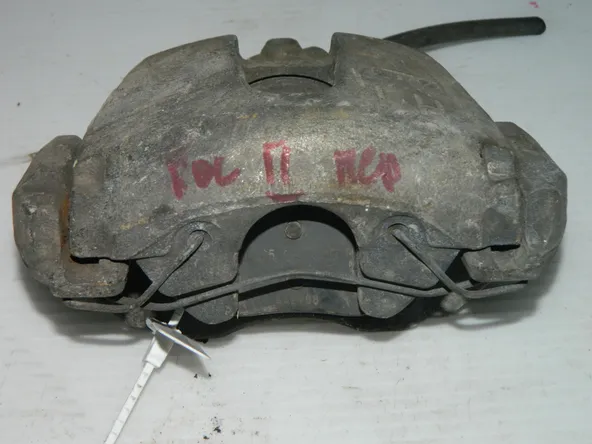 Суппорт тормозной FORD FOCUS 2 Перед Лев 45992338 Б/У