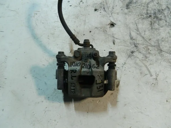 Суппорт NISSAN TEANA J31 Зад Лев (Контрактный) 101021062